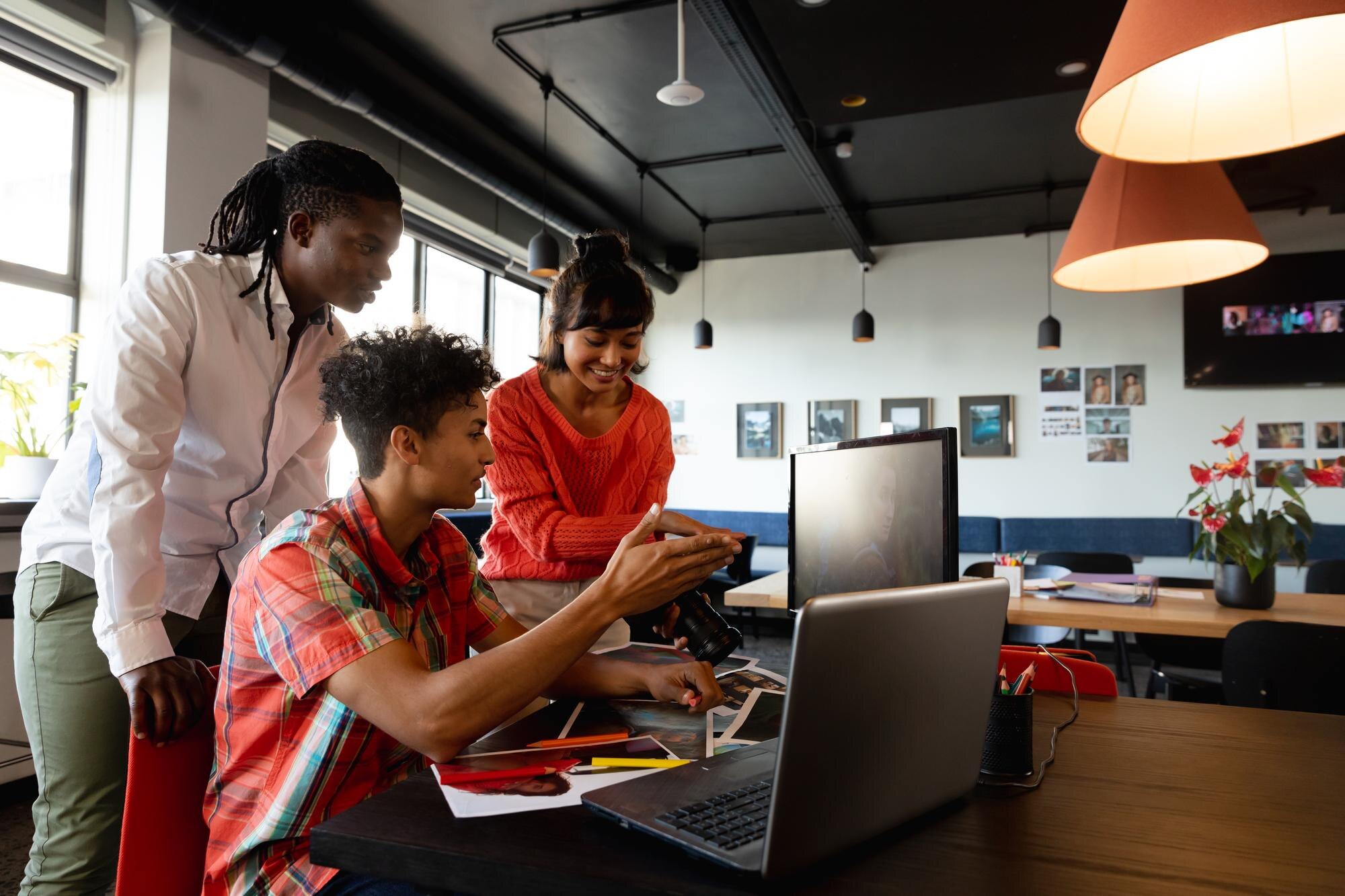 Multi-racial business colleagues discussing project and accessibility