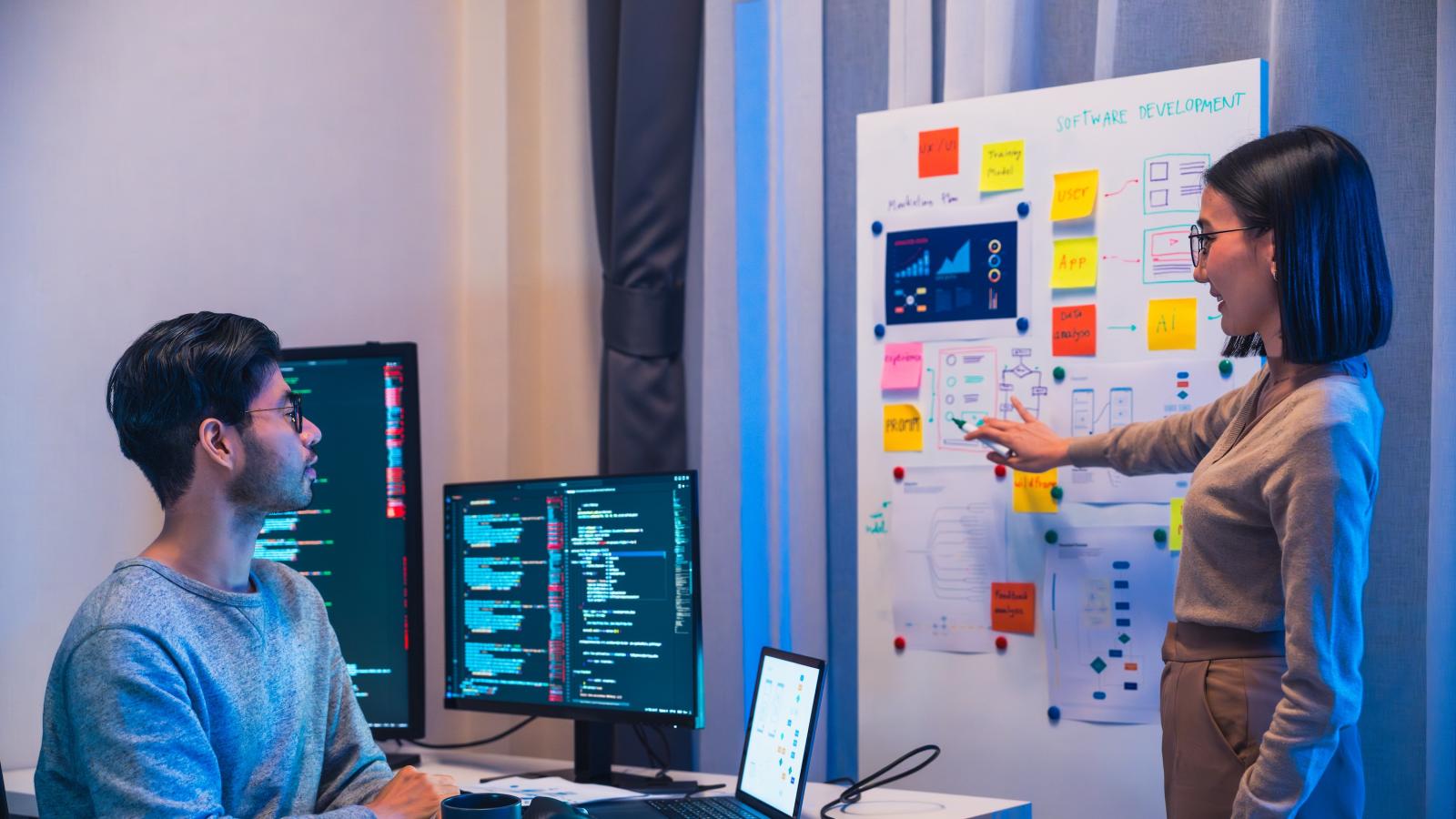 Developer and team designer present project interface design