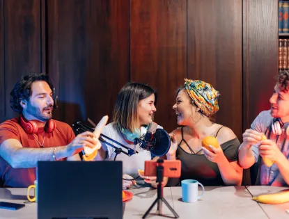 a group of male and female friends laughing on a bright background photo